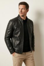 Black slim fit moto leather jacket for men with quilted shoulders and chest zip pockets