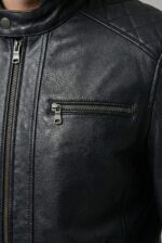 Gunmetal zipper detail on black full-grain moto leather jacket for men