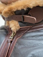 Authentic B-6 aviator shearling jacket showing heavy-duty brass zipper and leather pull tab