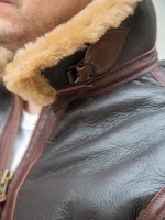 Close-up of the B-6 bomber jacket's cuff shearling detailing and sleeve adjuster