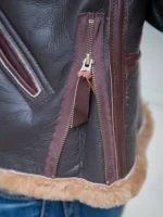 Close-up of the B-6 bomber jacket's cuff shearling detailing and sleeve adjusters