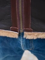 Close-up of the B-6 bomber jacket's cuff shearling detailing and sleeve adjuster
