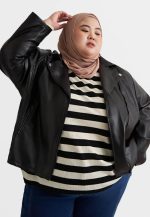 Hijabi Bike Rider wearing plus size moto jacket by Leatherings