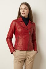Women’s dark red leather moto jacket laid flat
