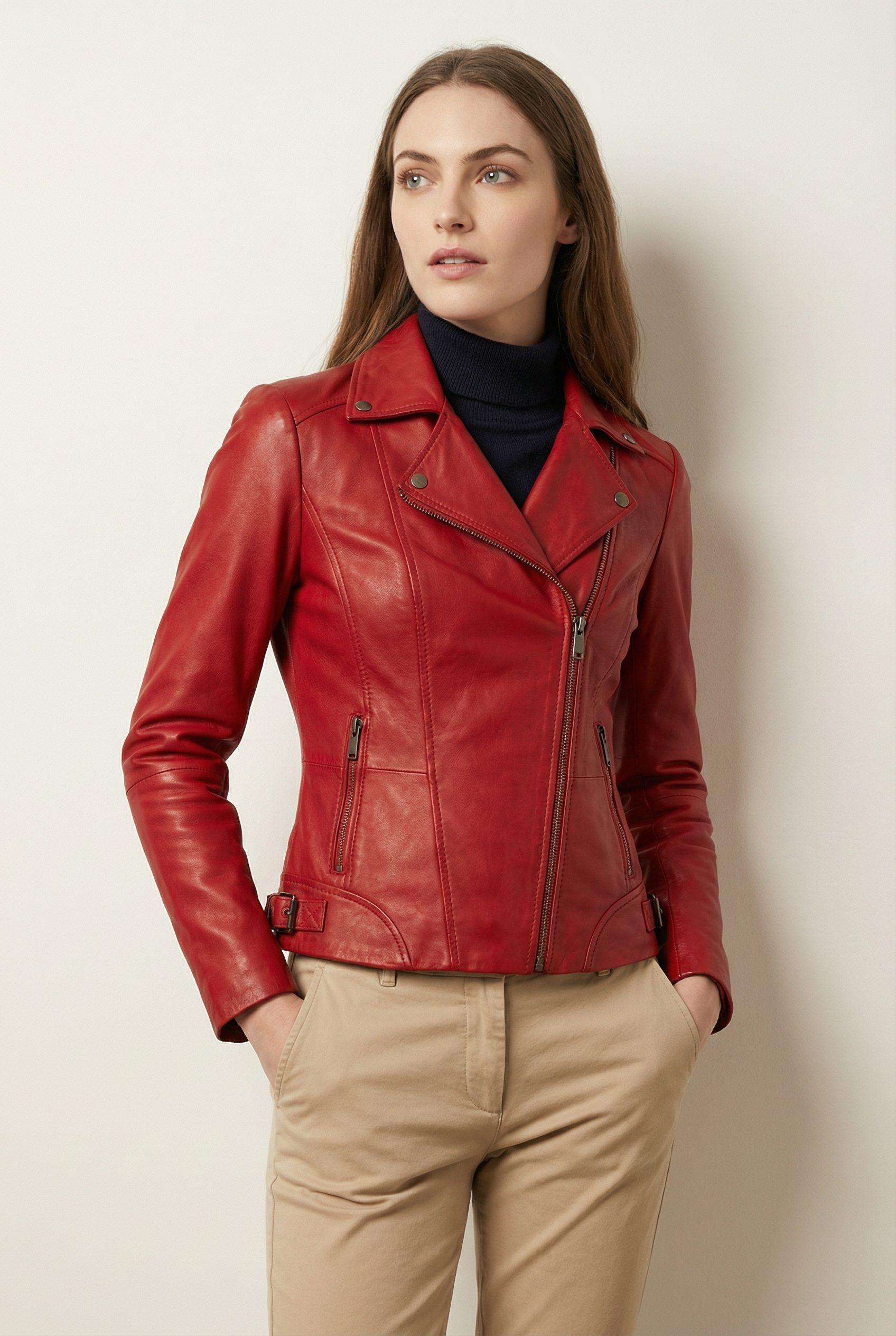 Women’s dark red leather moto jacket laid flat Women’s dark red leather moto jacket laid flat