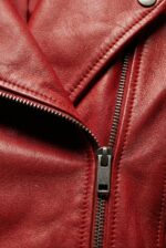 YKK metal zipper detail on women’s dark red leather moto jacket