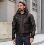 Model wearing brown A-2 pilot leather jacket with combat collar