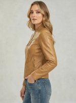 Side profile of women’s tan leather cafe racer jacket showing tailored fit and sleeve length