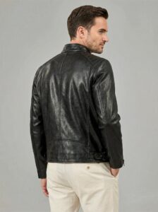 Back panel detail of Leatherings Obsidian black lambskin cafe racer jacket showing natural grain texture